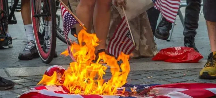 Trump DOJ quietly quits case against flag-burning protester at White House