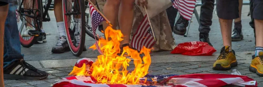 Trump DOJ quietly quits case against flag-burning protester at White House