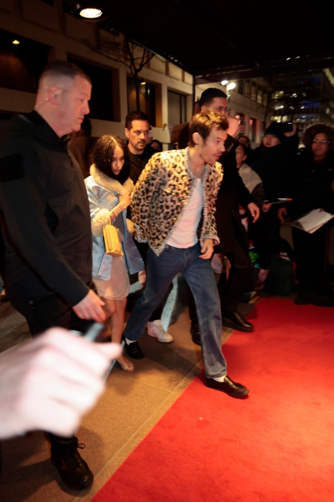 Harry Styles in a leopard print jacket and jeans at his SNL afterparty.