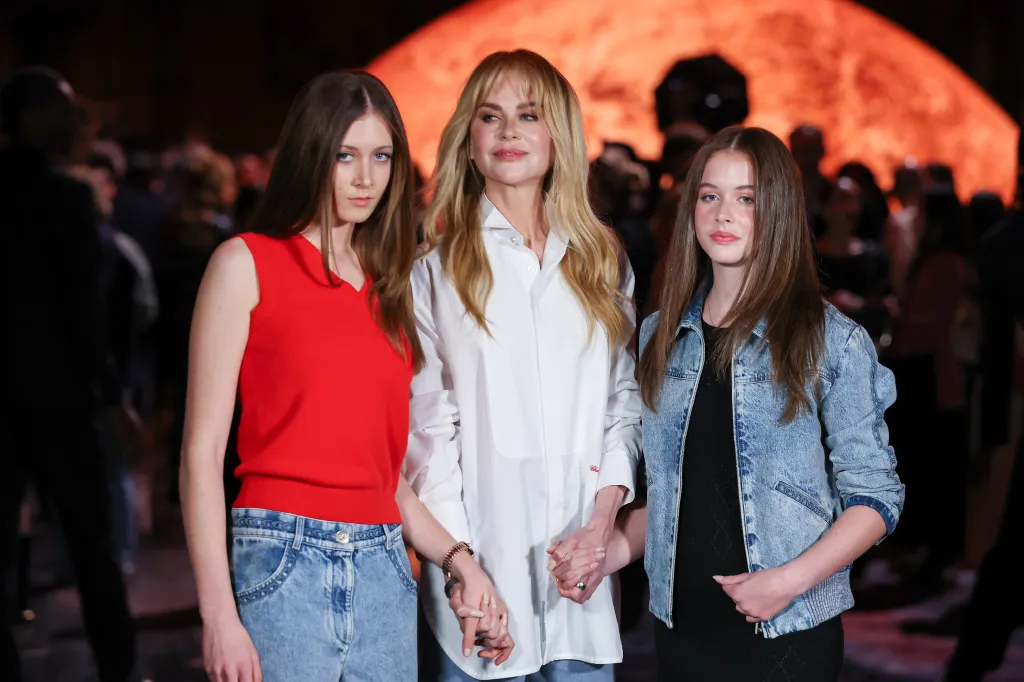Nicole Kidman, with her daughters Sunday Rose and Faith Margaret, attends a fashion show.