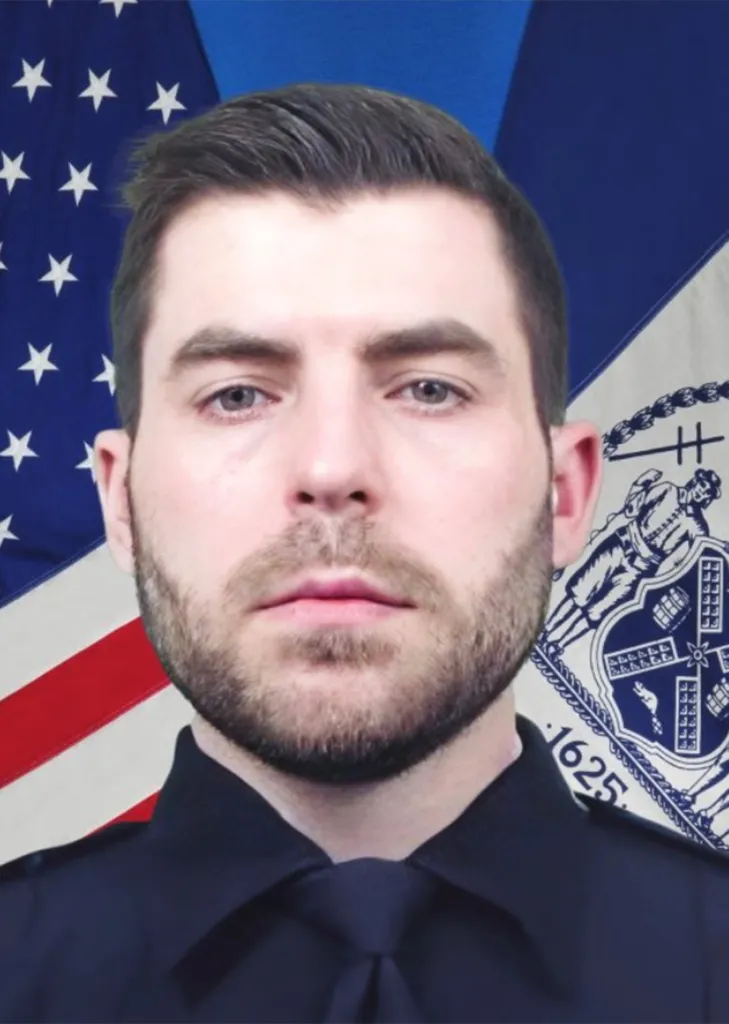 Headshot of NYPD Officer Jonathan Diller against a backdrop of the American flag and the New York City seal.
