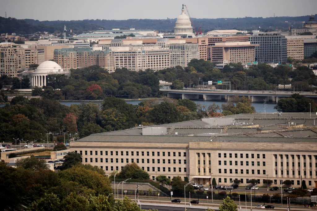 The Pentagon building is seen in Arlington, Virginia, with the U.S. Capitol building and other city buildings in the background.