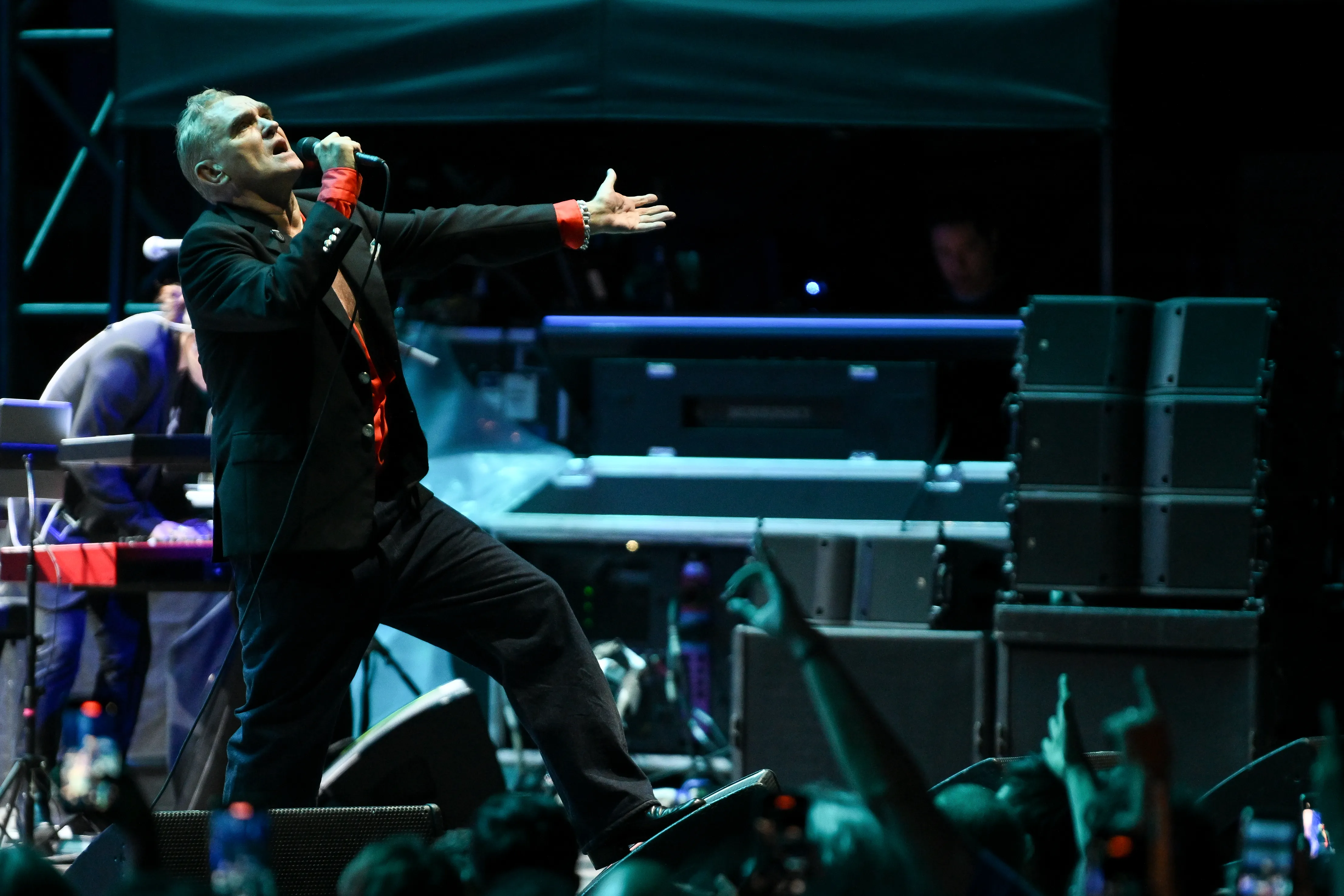 British singer Morrissey performing live on stage.