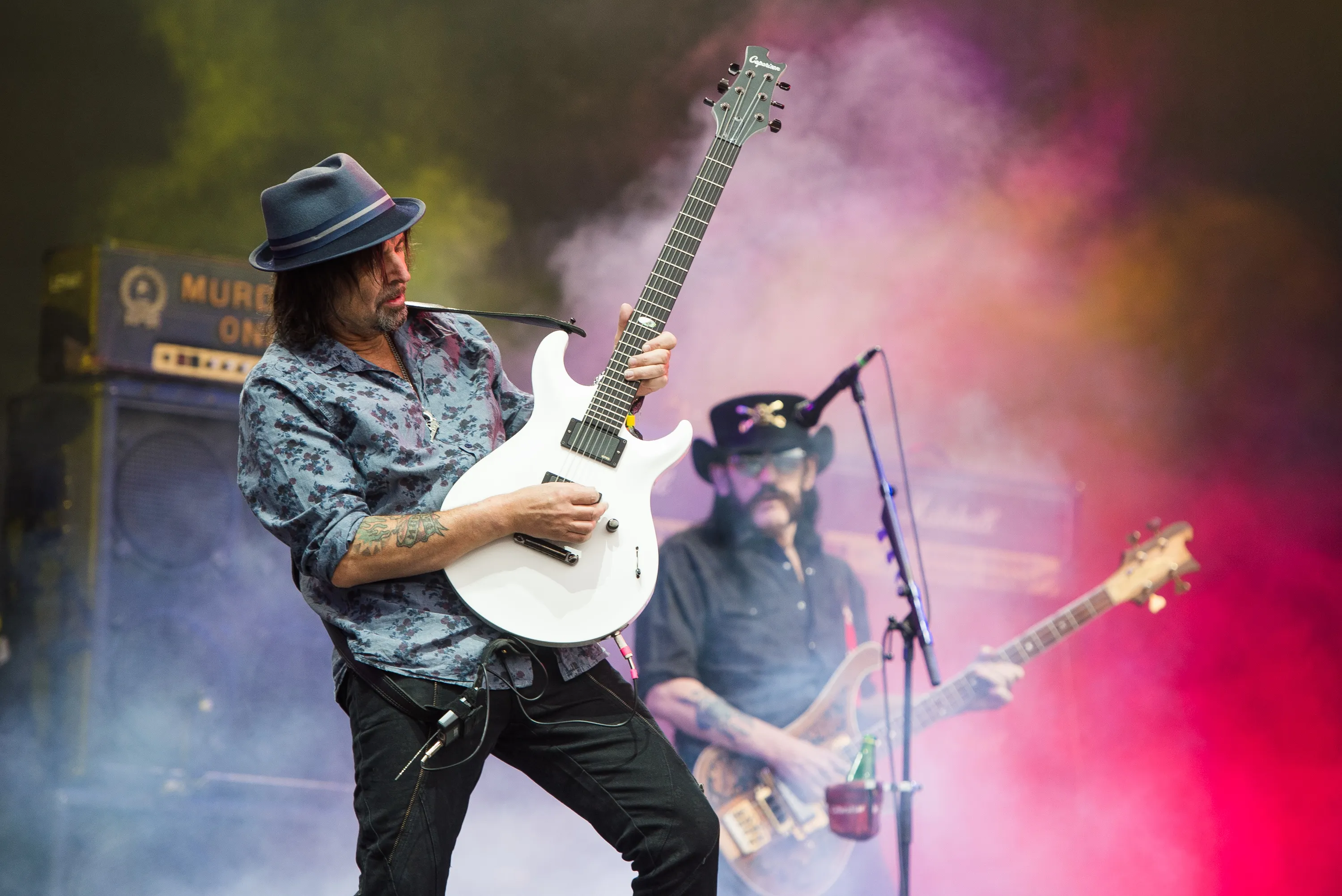 Phil Campbell of Motorhead playing guitar with Lemmy Kilmister in the background at Glastonbury Festival 2015.