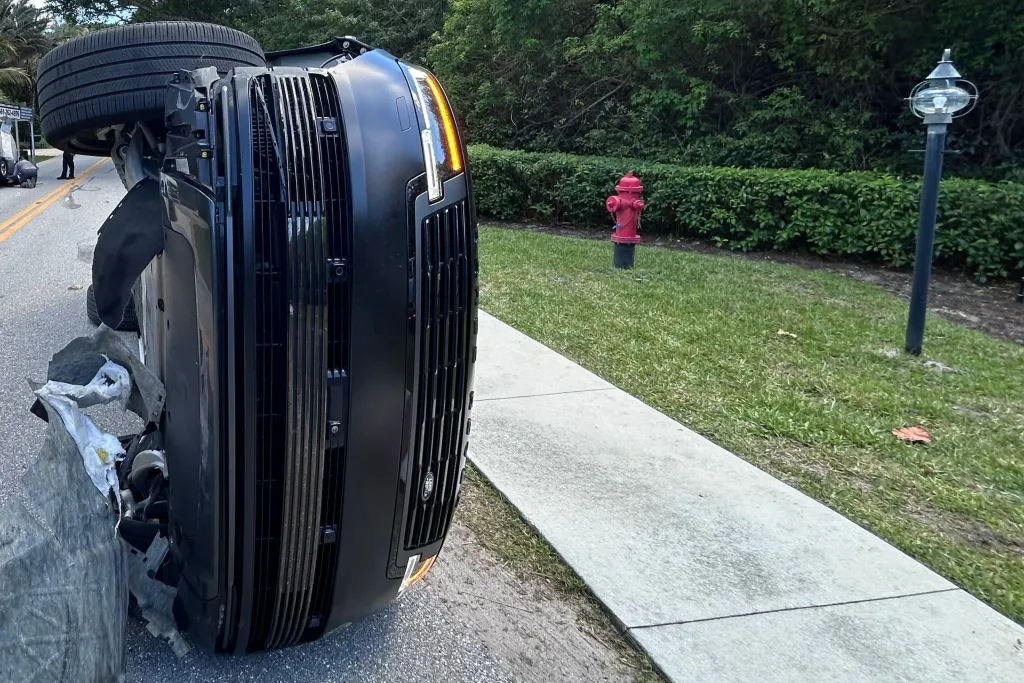 Overturned black SUV from the Tiger Woods crash.