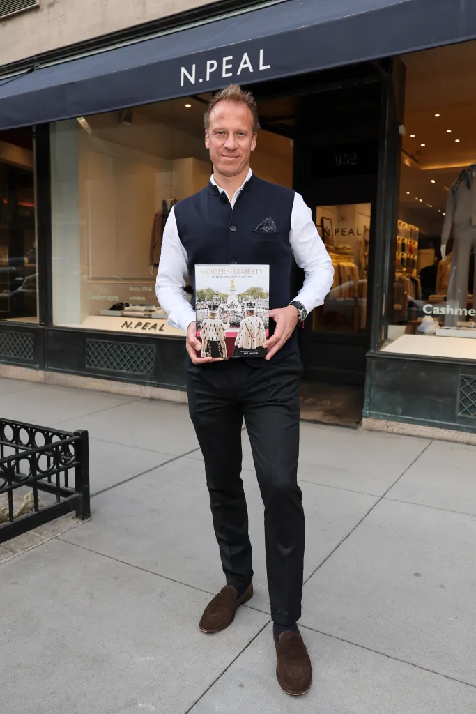 Photographer Chris Jackson holding his new book 