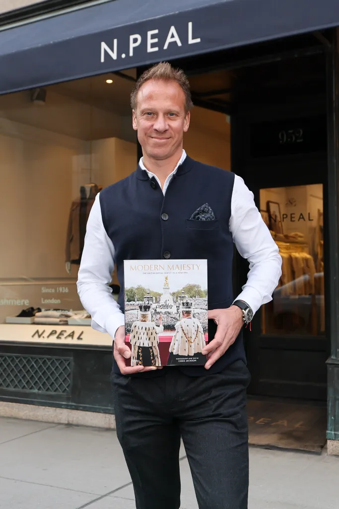 Photographer Chris Jackson holds his new book 