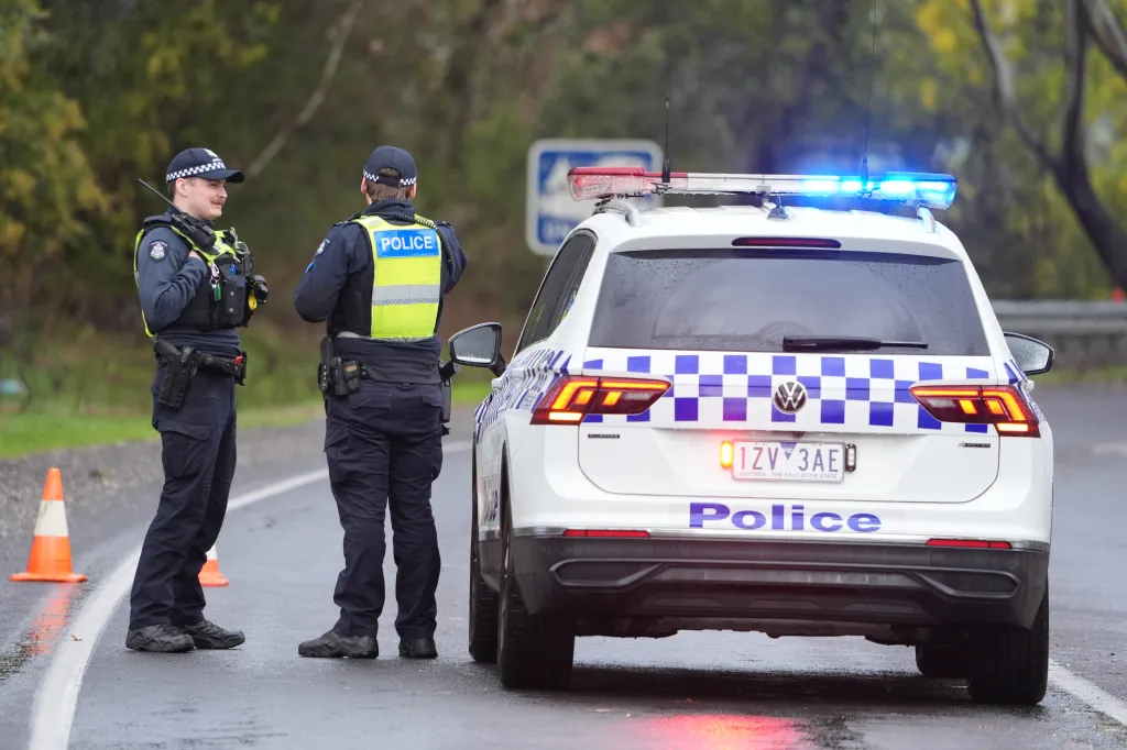 Police man a road block in Porepunkah, in the state of Victoria, Australia, on Aug. 28, 2025.