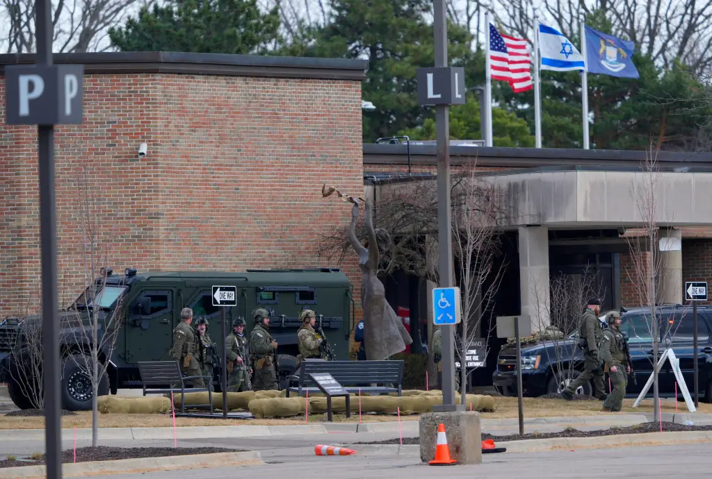 Police from various agencies standing outside Temple Israel in West Bloomfield.