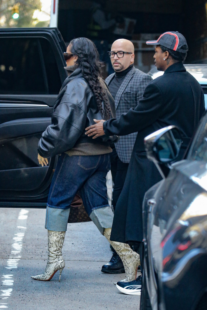 Rihanna and A$AP Rocky exiting a vehicle in NYC with increased security.