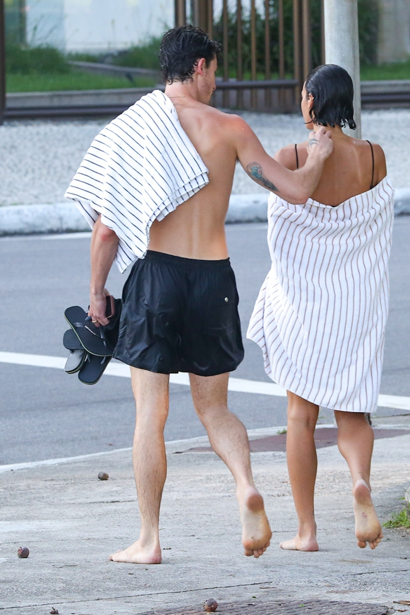 Mendes kept his other half close as they headed back to their place.