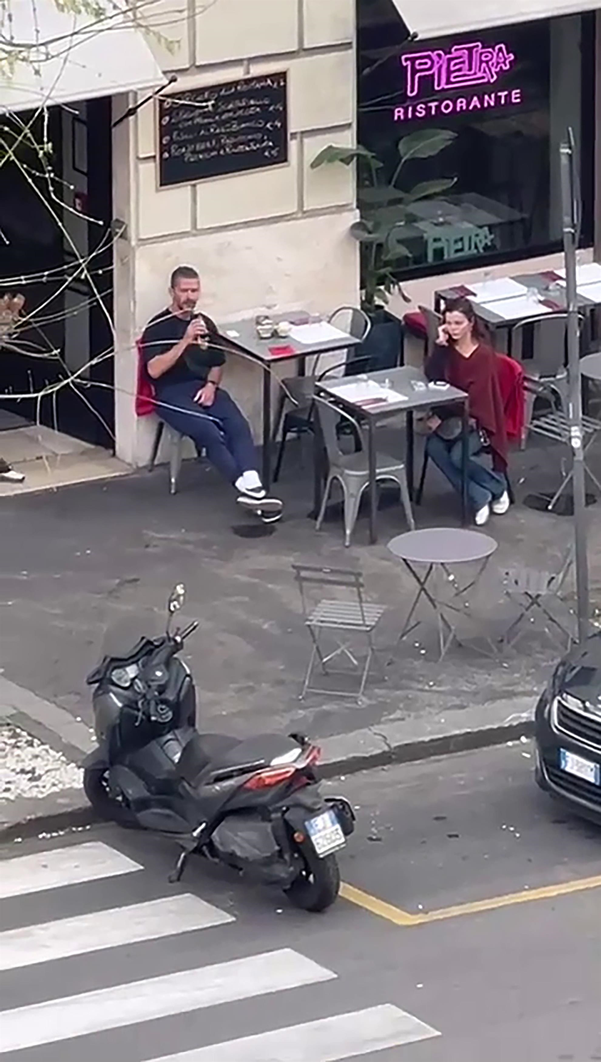 Shia LaBeouf seated outside Pietra Ristorante in Rome.