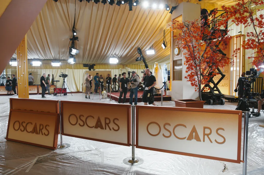 Preparations underway for the Academy Awards with crew, cameras, and 