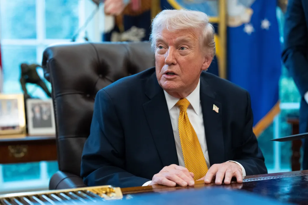 President Trump speaking in the Oval Office while signing an executive order for a fraud task force.