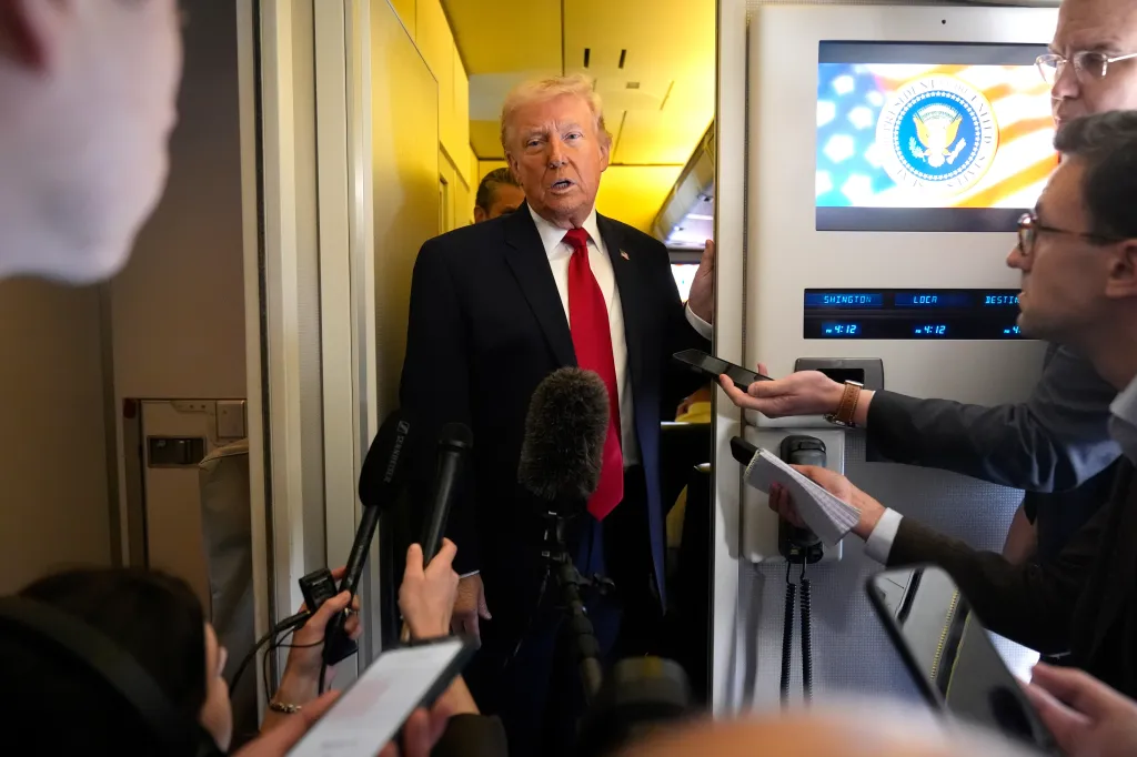 Donald Trump speaking to reporters in Air Force One.