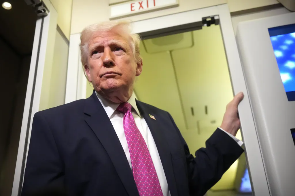 Donald Trump speaking to reporters aboard Air Force One.