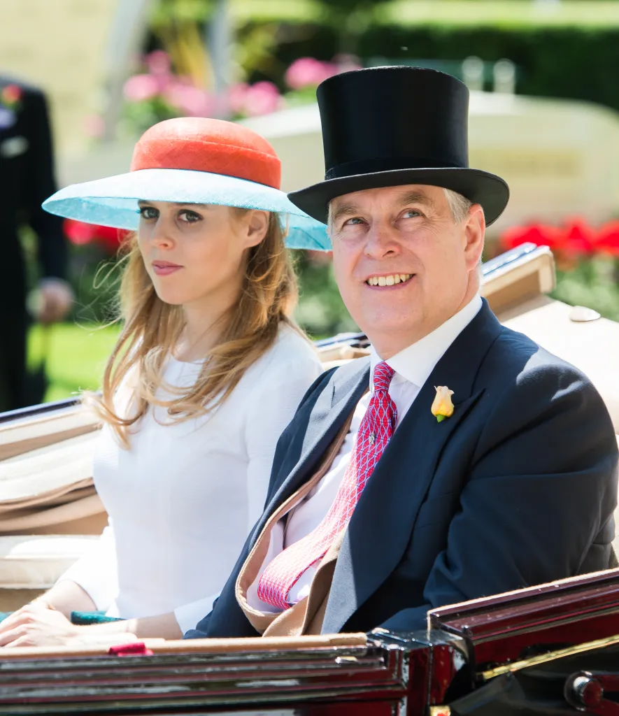 Princess Beatrice of York and Prince Andrew, Duke of York, riding in a carriage.