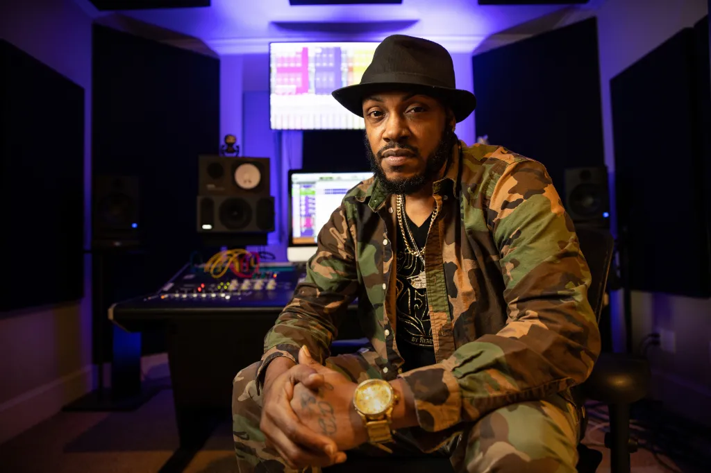 Rapper Mystikal poses for a portrait in a recording studio.