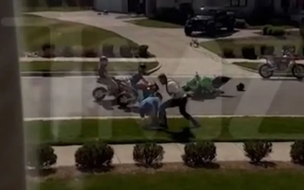 Still frame from a video showing Alan Ritchson attacking a neighbor in front of children.