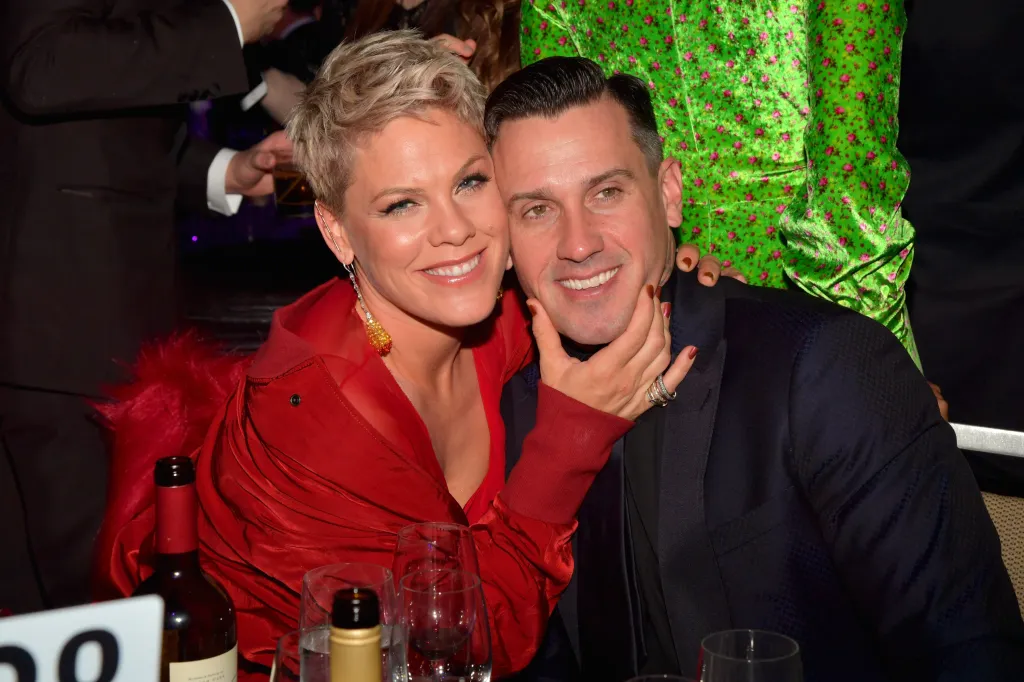 Recording artist Pink and Carey Hart smiling.