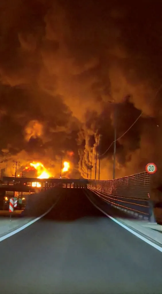 Fire and smoke rising from Aqdasieh Oil Depot in Tehran after a reported strike.