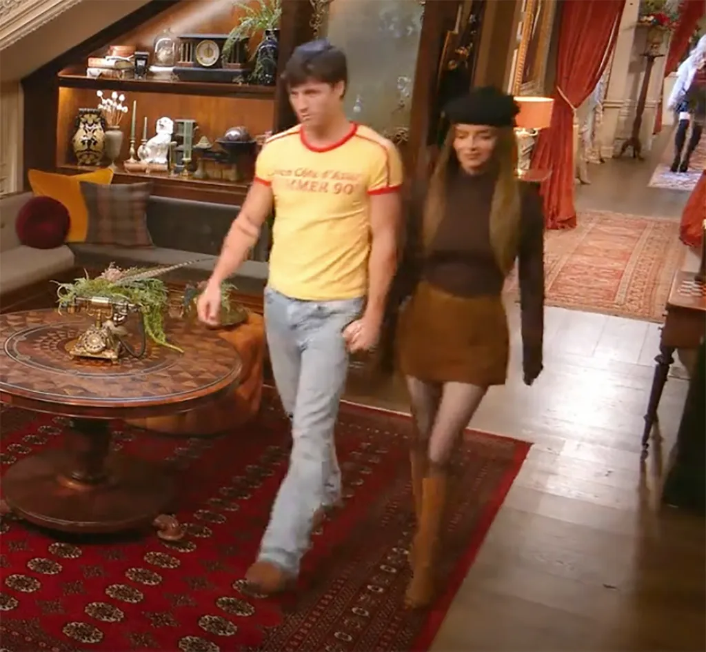 Rob Rausch and Maura Higgins walking together.