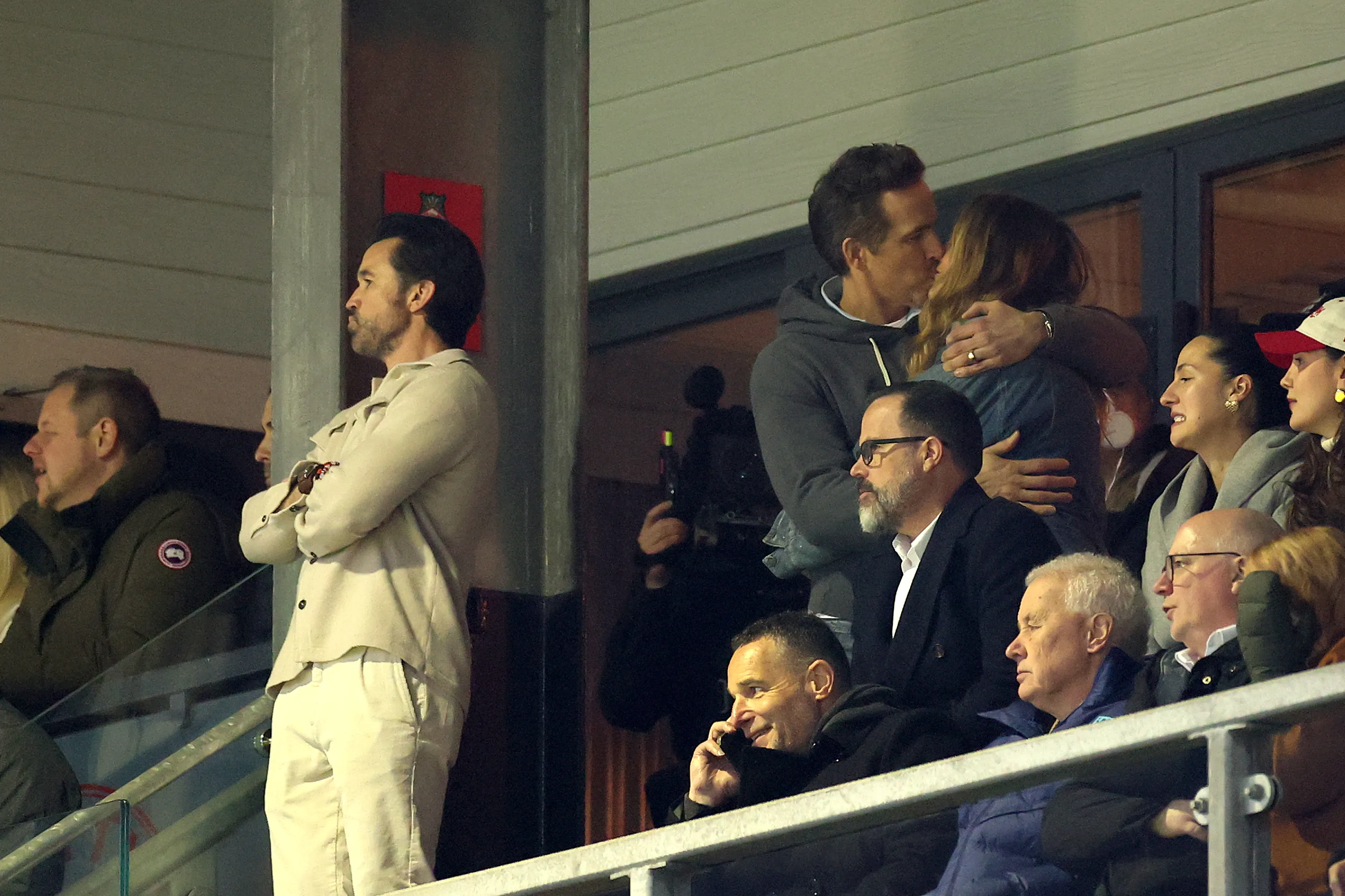 Ryan Reynolds and Blake Lively kissing at a Wrexham soccer match.