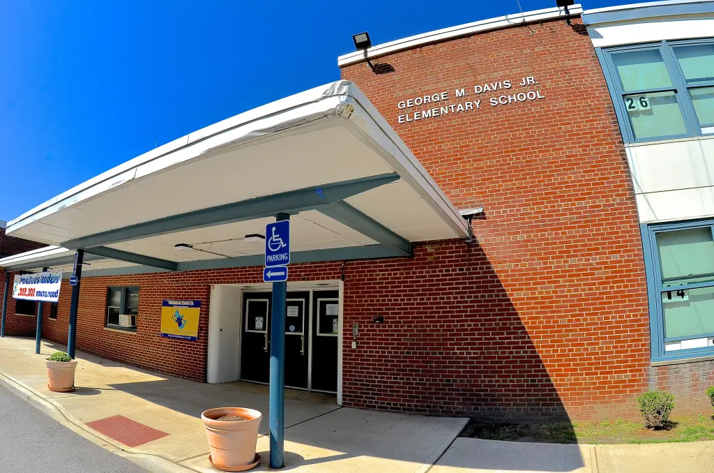 George M. Davis Jr. Elementary School building with a portico over its entrance.
