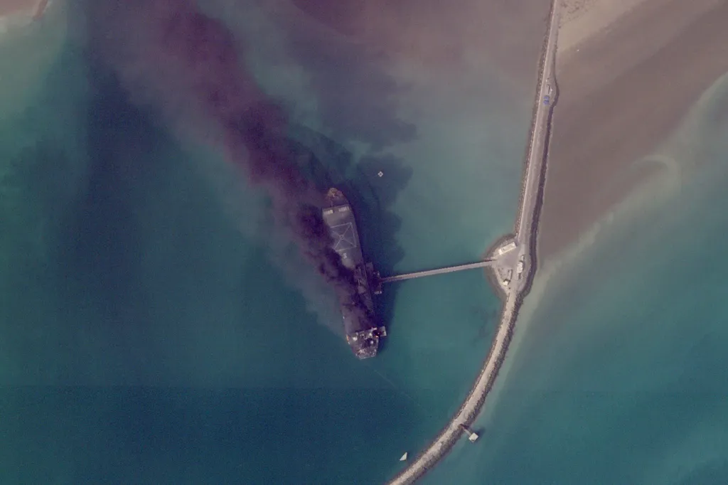 This satellite image from Planet Labs PBC shows fires burning on a ship after a U.S. military attack on a port in Bandar Abbas, Iran, on March 2, 2026.