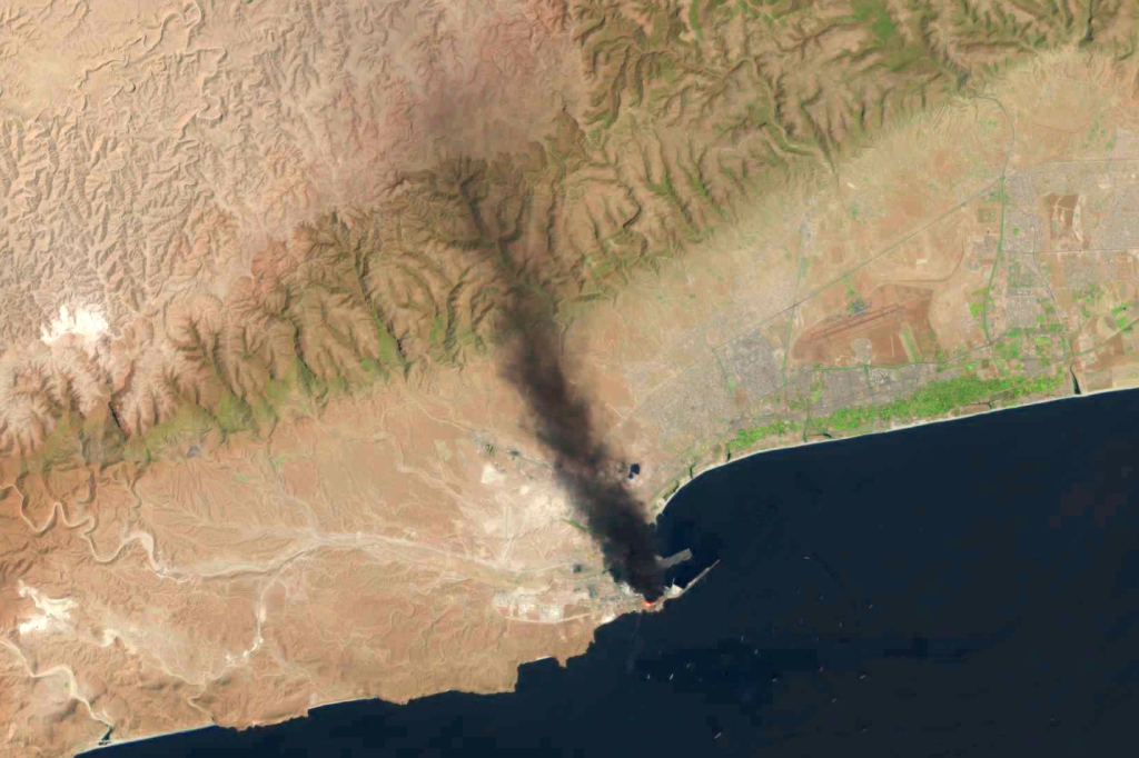 This satellite image taken by a US Geological Survey Landsat satellite shows a fire days after a suspected Iranian attack targeting the port in Salalah, Oman, Monday, March 16, 2026.