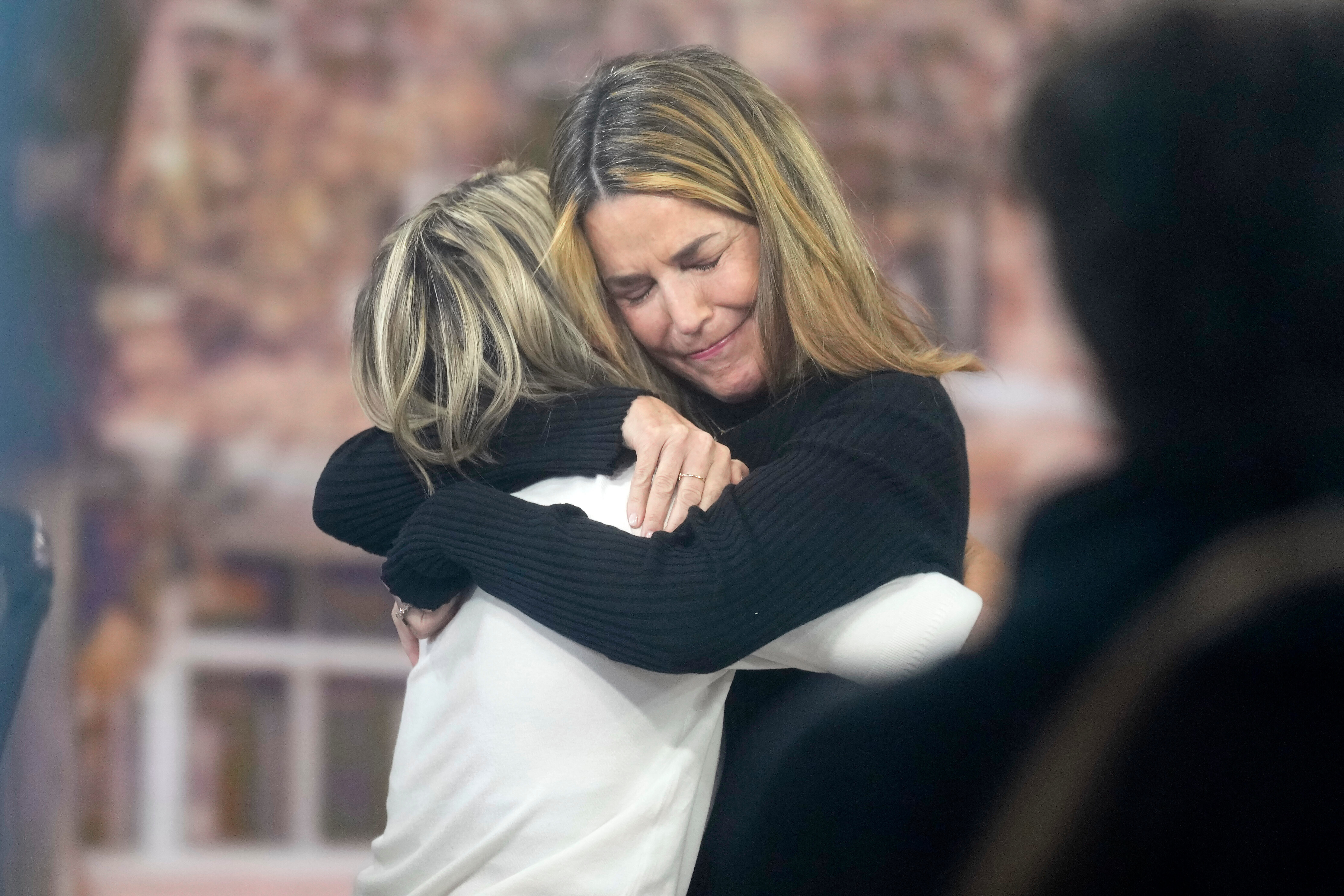 Savannah Guthrie tearfully hugging Dylan Dreyer.