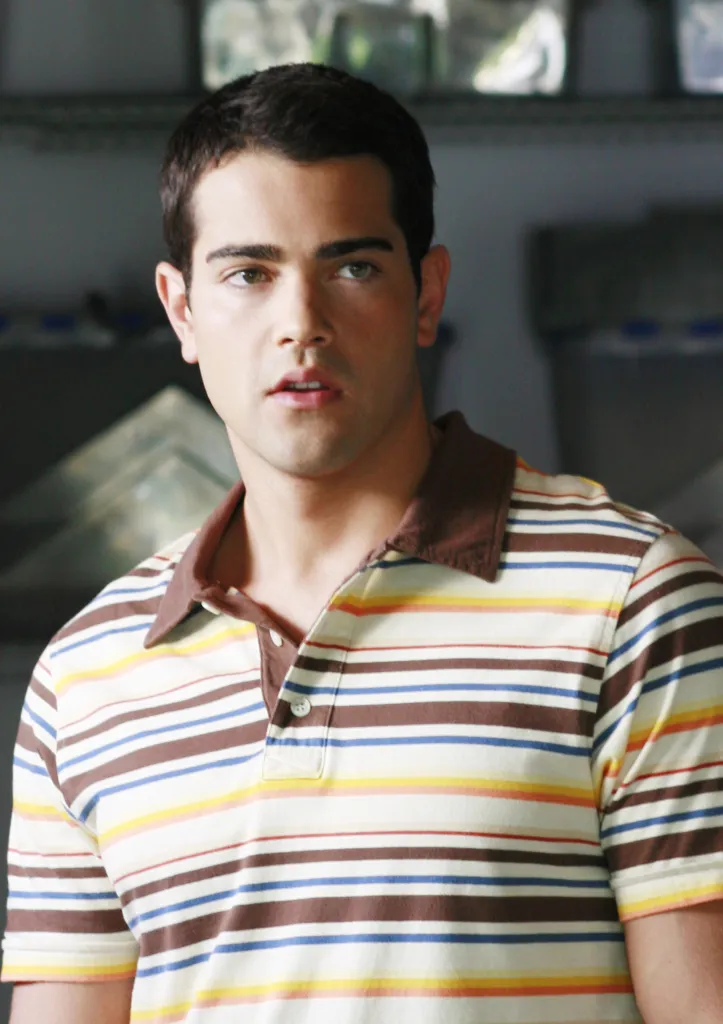Jesse Metcalfe in a striped polo shirt.