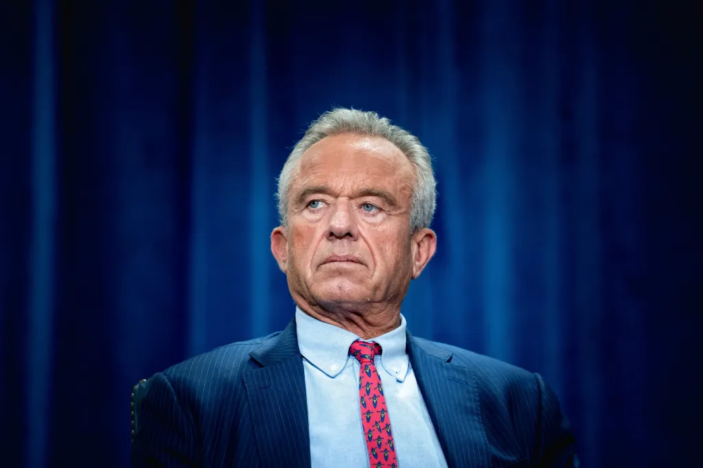 Secretary of Health and Human Services Robert Kennedy, Jr., listens to remarks during a press conference.