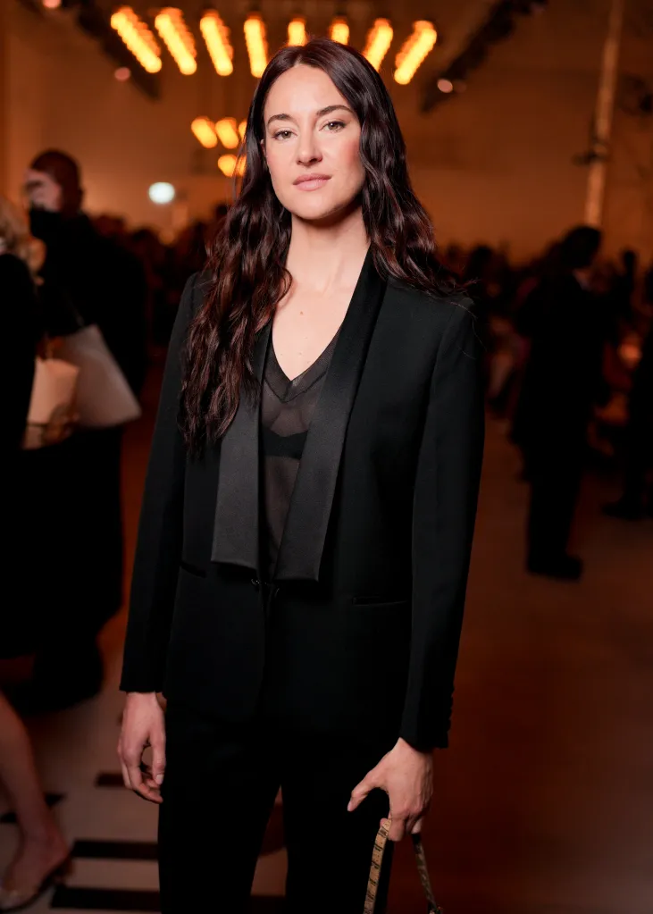 Shailene Woodley attending the Fendi fashion show in a black blazer and sheer top.