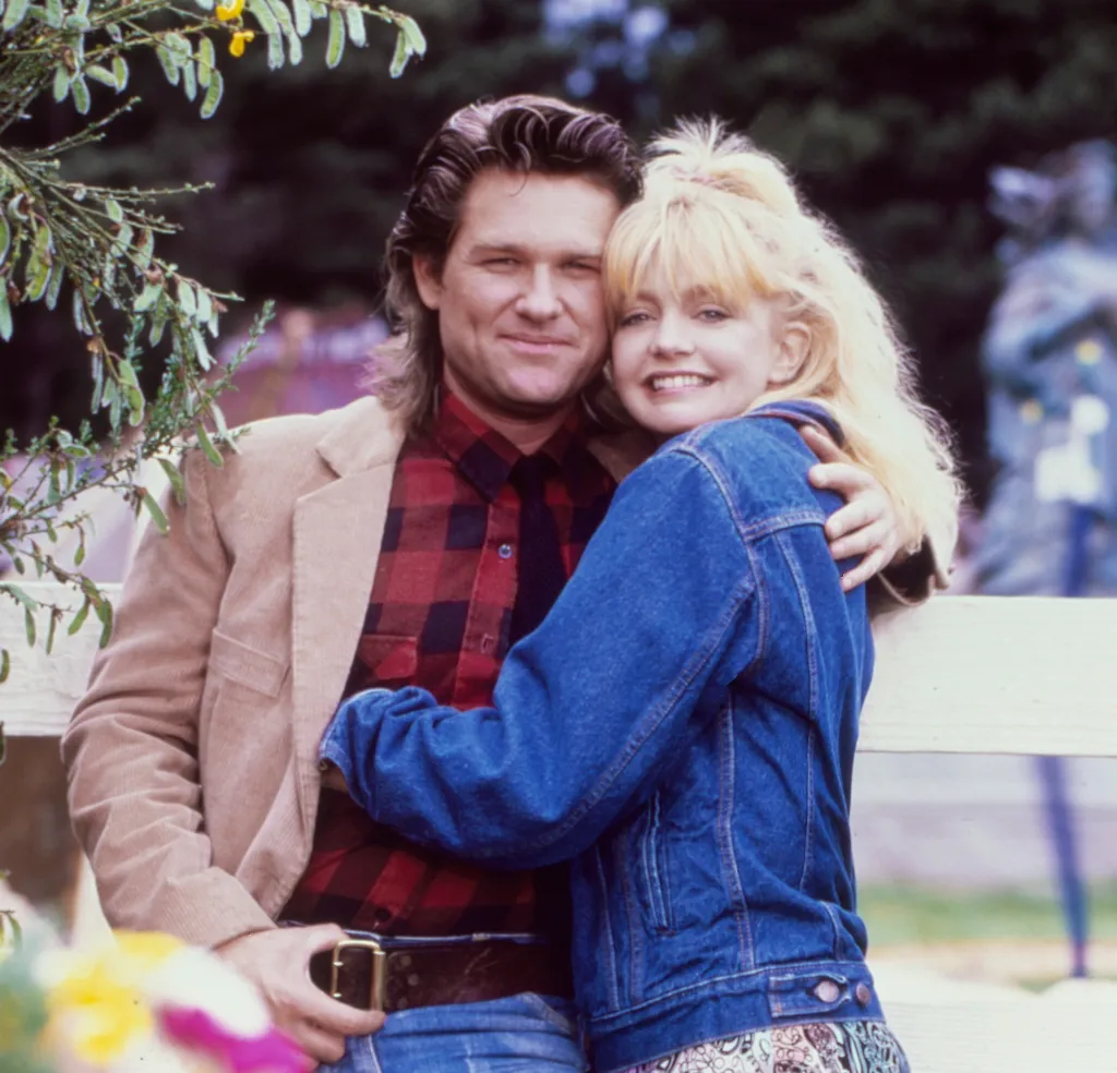 Goldie Hawn and Kurt Russell embrace during the filming of 