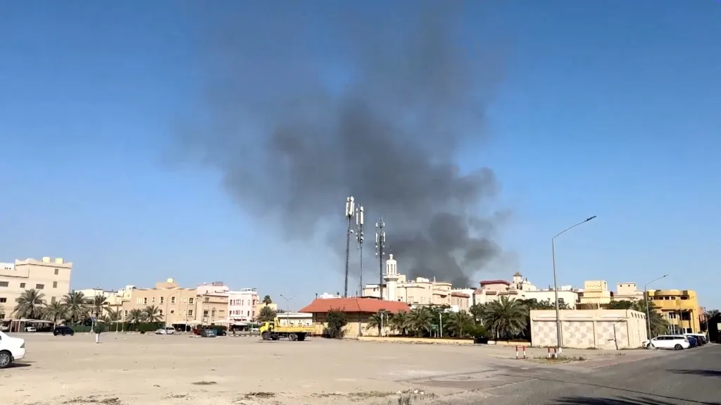 Smoke rises from an area near the U.S. Embassy in Bayan, Kuwait.