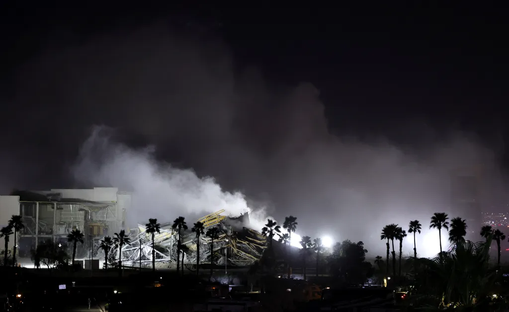 Smoke rises from a pile of rubble after the implosion of the Eastside Cannery Casino and Hotel tower.