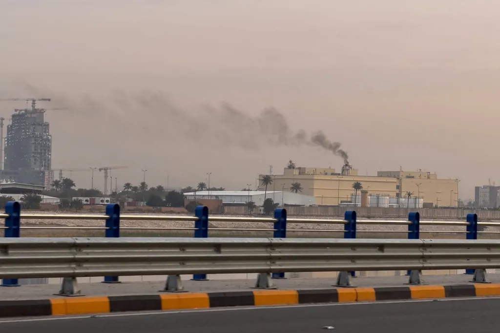Smoke rises from the U.S. embassy building in Baghdad, Iraq, Saturday, March 14, 2026.