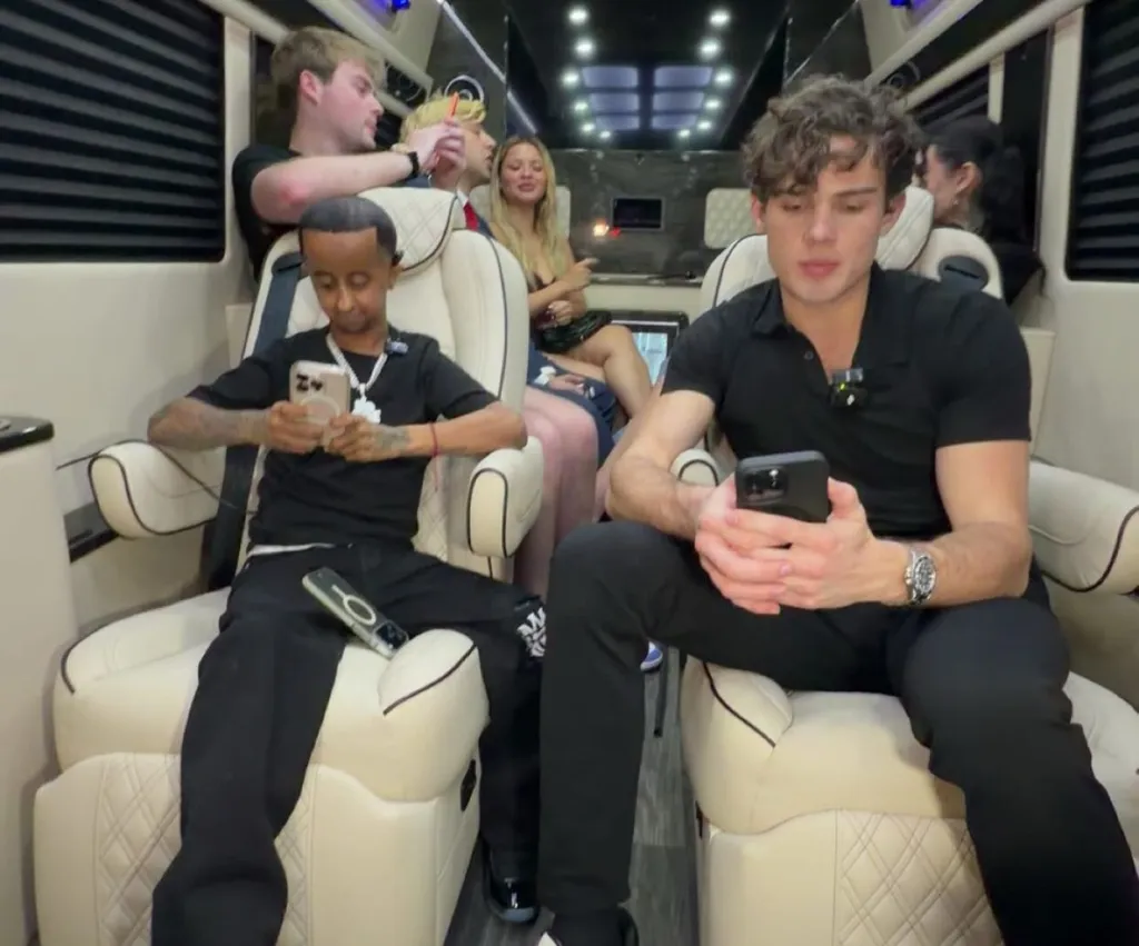 People using their phones while sitting in a vehicle.