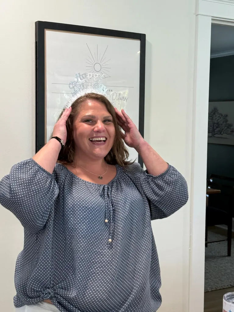 Stephanie Nicole Minter smiling and wearing a 