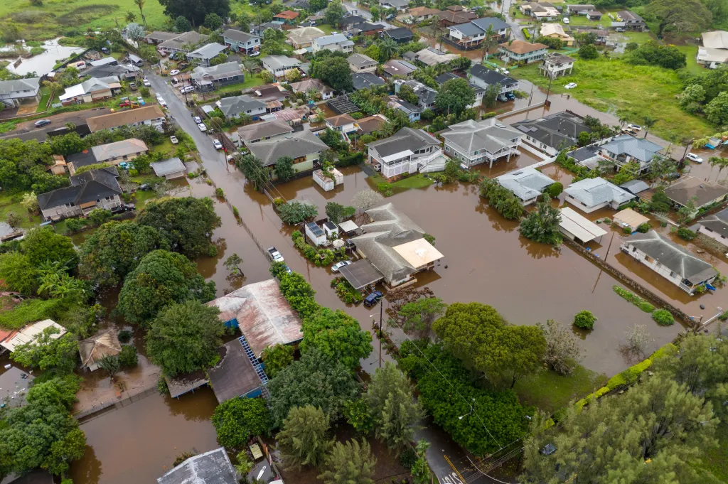Aerial view of Haleiwa, Hawaii, showing flooded streets and homes after severe rains.
