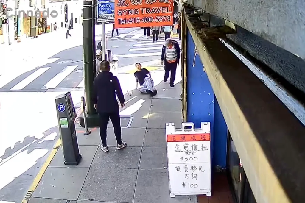 Surveillance footage shows a man sitting on the ground after being stabbed in San Francisco's Chinatown.