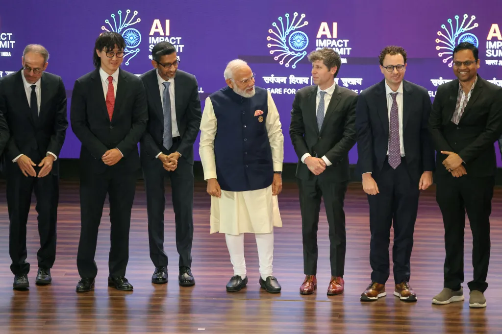 India's Prime Minister Narendra Modi poses with AI company leaders, including Sam Altman, Sundar Pichai, and Dario Amodei, at the AI Impact Summit.