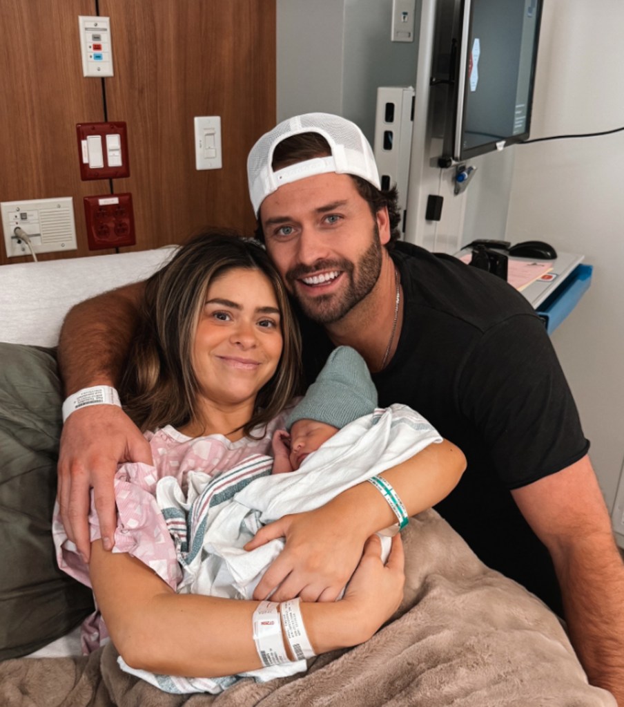 Taylor Frankie Paul and Dakota Mortensen posing with their newborn baby.