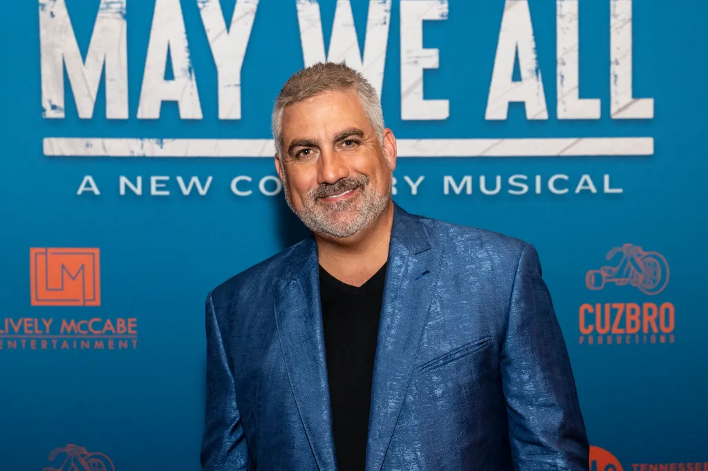 Taylor Hicks smiling at the opening night of 