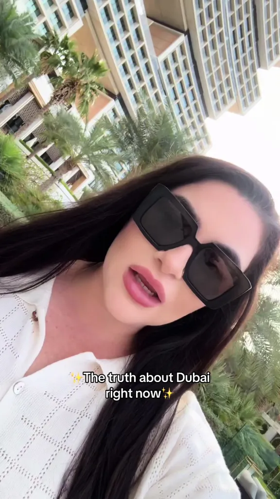 Soudi Al Nadak in Dubai wearing sunglasses with the text 