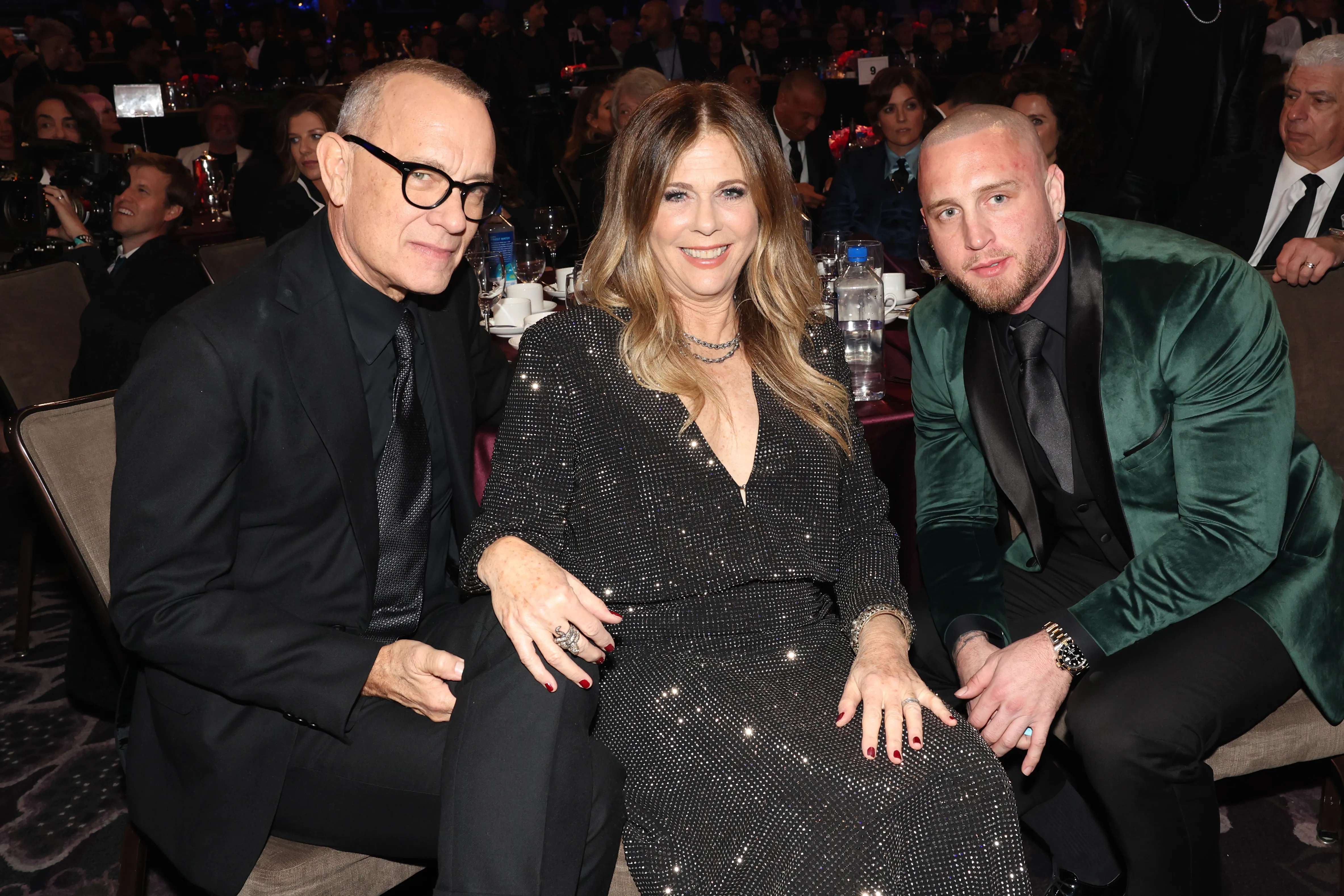 Tom Hanks, Rita Wilson, and Chet Hanks pose for a photo at an event.