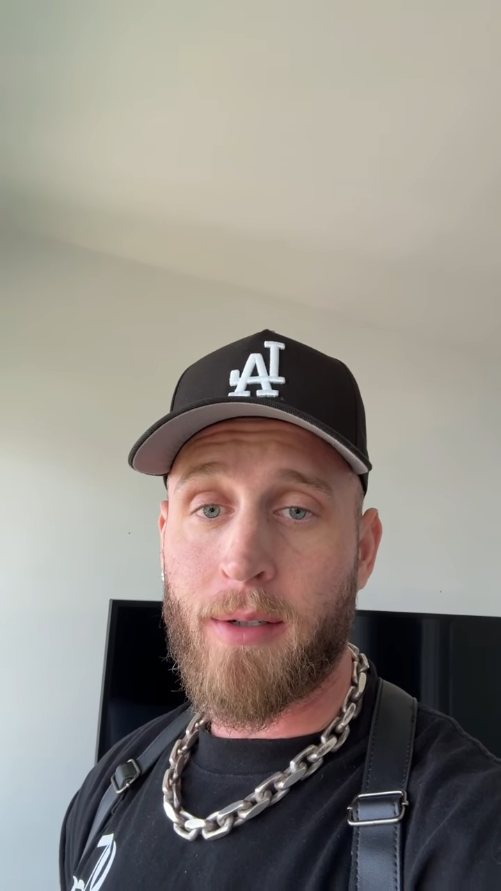 Chet Hanks wearing a black baseball cap with 