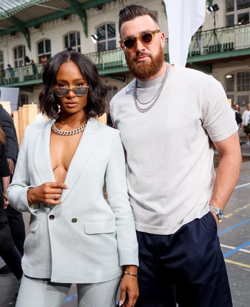 Kayla Nicole and Travis Kelce posing for a photo.