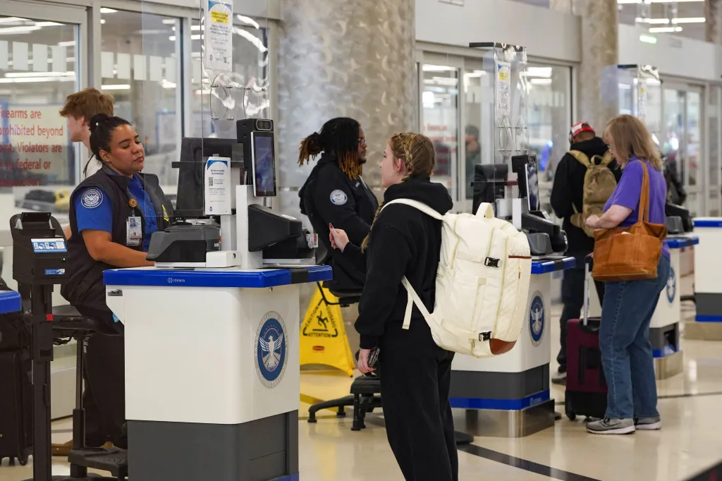 A passenger goes through a TSA security check on March 20, 2026.